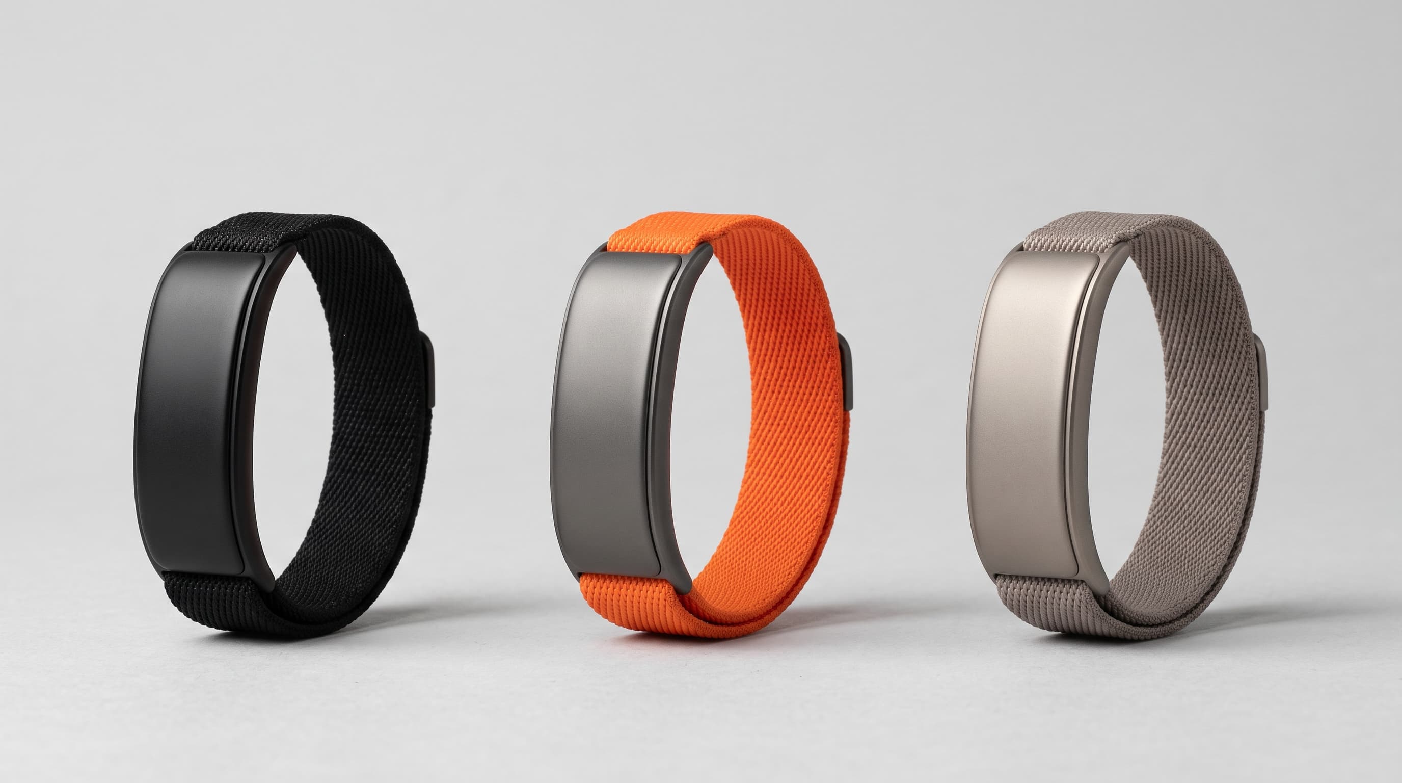 PACE Band in Carbon Black, Signal Orange and Stone Titanium, standing side by side